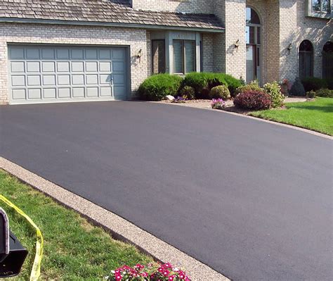 asphalt on top of concrete driveway