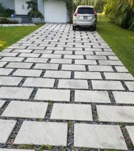 concrete driveway with stones