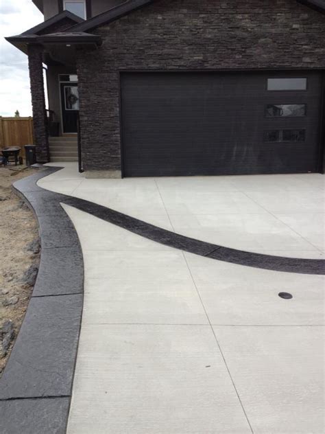 modern black concrete driveway