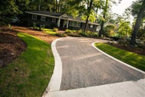 river rock concrete driveway